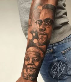 a person with a tattoo on their arm and the image of two men in glasses