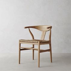 a wooden chair sitting on top of a white floor