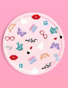 a paper plate with various stickers on it