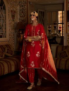 Enter the world of luxurious & regal clothing with Sahiba. Celebrate the grandeur of beauty, celebrations, dressing up and womanhood with vintage textiles and silhouettes. Set of 3 consists of kurta, salwar and dupatta. Kurta: A red chanderi silk kurta is detailed with with hand embroidered floral bunches in pittan. Dupatta: An ombre dyed muslin silk dupatta in peach and red is detailed with gota dhari embroidery finished with contrast magzi and kiran detailing. Bottom: Red cotton silk salwar is Salwar Pants, Red Kurta, Salwar Pattern, Colour Combinations Fashion, Kurta Set For Women, Silk Kurta, Dress Indian Style, Dress Indian, Silk Dupatta