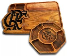 two wooden trays with monogrammed designs on them