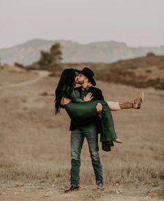 a man holding a woman in his arms