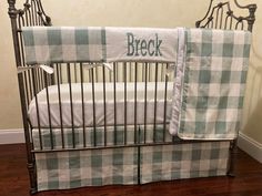 a baby crib with a blanket that says break on the bottom and side rails