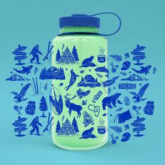 a blue and green water bottle sitting on top of a blue background with images of animals