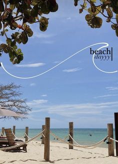 an umbrella and some chairs on the beach