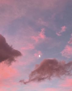 the sky is pink and blue with clouds