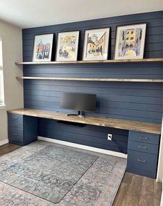 a room with blue painted walls and shelves on the wall, along with a rug