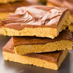 chocolate and peanut butter bars stacked on top of each other