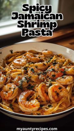 spicy jamaican shrimp pasta in a white bowl with parsley on top and text overlay that reads spicy jamaican shrimp pasta