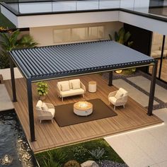 an outdoor living area with couches and chairs