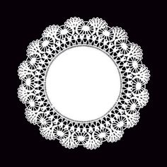 a white doily on a black background with an empty circle cut out in the middle