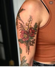 a woman with a flower tattoo on her arm