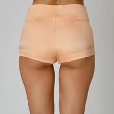 Introducing our Orla Silk Shorts, blending luxurious comfort with versatility. Expertly crafted from coral double silk satin, they feature a mid-waist and a sleek design, completed by a concealed side zip closure. Pair them with a breezy cover-up for a chic seaside look or dress them up under sheer dresses, for an elevated yet relaxed ensemble.  Match: Wear them under our Orla Silk Shirt Dress. Each Il Volo item is handmade by skilful artisans in our Bucharest atelier and it is created in limited series. 100% Italian Double Silk Satin.  Gentle dry clean. Do not wash. Do not use chlorine based bleach. Do not tumble dry. Cool iron, max 110 C.  Made in EU. Pink Stretch Satin Bottoms, Stretch Satin Bottoms For Summer, Fitted Satin Summer Pants, Fitted Satin Pants For Summer, Spring Satin Bottoms In Short Length, Summer High Waist Satin Bottoms, Fitted Satin Bottoms For Summer, Spring Silk Bottoms With Satin Finish, Silk Bottoms With Satin Finish For Spring