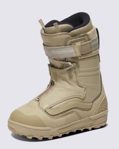 the snowboard boots are beige and have two straps on each side of the boot