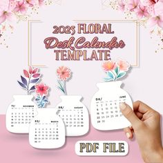 a hand holding a calendar with flowers on it and the words, 2013 floral desk calendar template