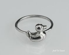 "This sterling silver ring features a rubber ducky, a whimsical touch of childhood or for someone who loves ducks! The duck may face to the left or to the right (as shown in the photos). If you have a preference, let me know, otherwise I'll select one at random for you. I create these rings by hand, measuring, soldering and shaping the ring base first from sturdy 14 gauge round wire, then permanently soldering the accent piece on. Each ring will be a bit different due to their handmade nature. A Space Rings, Paper Gift Box, Rubber Ducky, The Duck, Gift Wrapping Services, Paper Gifts, Ducks, Accent Pieces, Phone Ring