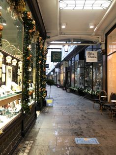 the inside of a store with lots of windows and decorations on it's sides