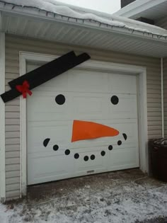 a garage door decorated to look like a snowman