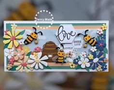 a close up of a card with flowers and bees