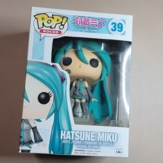 the pop vinyl figure has blue hair and is in a box with it's packaging