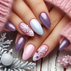 Add a playful touch to your holiday style with these cute purple and pink Christmas nails! Perfect for Xmas celebrations, these holiday nail designs feature festive patterns like candy canes, snowflakes, and glitter accents. Whether you're going for a fun, whimsical look or a more elegant vibe, these festive nail designs will add holiday cheer to your celebrations. Explore creative Xmas nail art ideas that will bring out the fun side of the season! Purple Nails For Christmas, Sugarplum Purple Nails, Purple Winter Nails Acrylic, Light Purple Winter Nails, Pink And Purple Christmas Nails, Dark Purple Christmas Nails, Pastel Holiday Nails, Colourful Christmas Nails, Nails 2024 Christmas