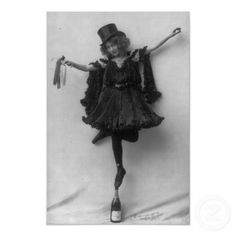 an old photo of a woman in a dress and top hat holding a wine bottle