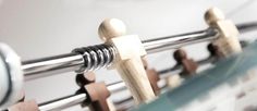 a close up view of some clothes pins on a rack