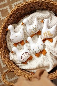 some white and orange stuffed animals in a basket