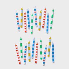 many colorful candles are arranged in the shape of a circle