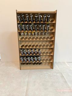 a wooden shelf filled with lots of cans