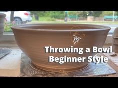 a bowl sitting on top of a table with the words throwing a bowl beginner style