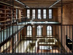 the inside of an old building with lots of windows and bars on each side of it