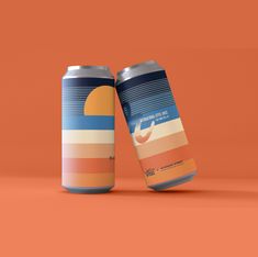 two cans of soda on an orange background