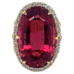 20.30 Carat Purplish Red Oval Rubellite with Diamond set in 18 Kt yellow gold Oval Diamond Cut Ruby Ring, Luxury, Luxury Ruby Ring With Oval Cabochon, Luxury Ruby And Diamond Oval Cabochon Ring, Vintage Ruby Ring 1stdibs, Luxury Fine Jewelry Ruby Ring With Cabochon, Luxury Ruby Cabochon Diamond Ring, Gem Stone, Diamond Set, Vintage Jewels