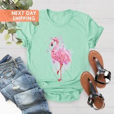 "Watercolor Flaming Shirt, Women's Flamingo Shirt, Flamingo Tee, Flamingo Gift, Flamingo Gift for Women, Flamingo Lovers, Flamingo Shirt Gift BLACK TEXT is used by for Yellow, Heather Peach, White, Light Gray Heather Shirts. WHITE TEXT is used by Other Colored Shirts. Hi! Welcome. It's great to see you here! ☺️  Our shirts are clean, high quality and soft. It is prepared quickly by our boutique.  Ironing and shipped.  Enjoy your shopping!  It is a pleasure for us to help you with your questions Summer Pink Flamingo Print Top, Summer Cotton Tops With Flamingo Print, Summer Cotton Top With Flamingo Print, Casual Summer T-shirt With Flamingo Print, Casual Flamingo Print T-shirt For Summer, Casual T-shirt With Flamingo Print For Summer, Casual Flamingo Print Tops For Spring, Casual Spring Tops With Flamingo Print, Cotton Top With Flamingo Print For Summer