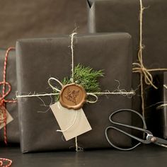 presents wrapped in brown paper and tied with twine are sitting next to each other