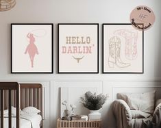 a baby's room with three posters on the wall