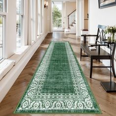 a large green rug in the middle of a room