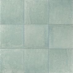 a blue tile wall with several squares in it