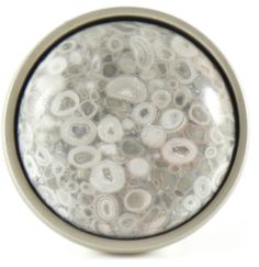 a close up view of some beads in a glass container