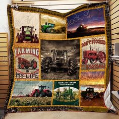 a quilt with pictures of tractors and farm equipment on it, hanging from a wall