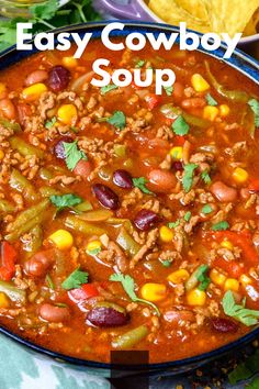 easy cowboy soup in a bowl with corn, beans and tortilla chips on the side