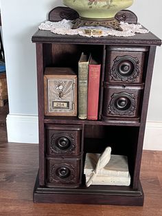 a book shelf with books and other items on it