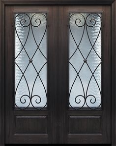 the front door is made of wood and has two glass panels on each side, along with wrought iron work