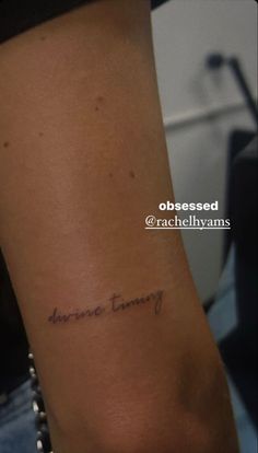 a woman with a small tattoo on her arm