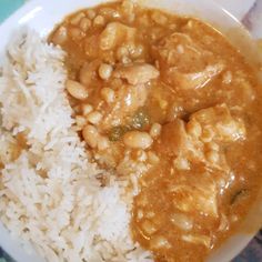 a white plate topped with rice and beans