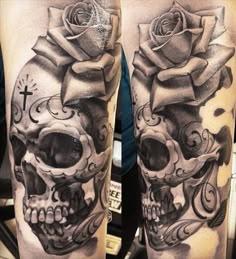 a man's leg with a skull and rose tattoo on it