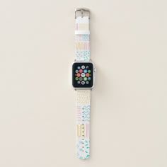 an apple watch sitting on top of a white surface