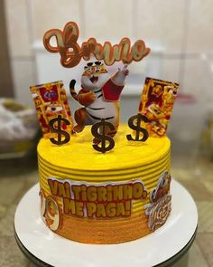 a birthday cake decorated with an image of a cat and money signs on top of it