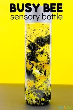 a glass jar filled with yellow and black bugs